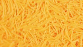 Background of Uncooked Noodles that Slowly Moving Up - Top View. Raw Pasta in Move. Texture of Dry Vermicelli video