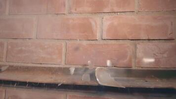 Firecracker Exploaded in Wineglass Against a Brick Wall - Super Slow Motion. The Blast Wave of a Petard Damaged the Glass and Many Small Fragments of Glass Flew in Different Directions - Static Shot video