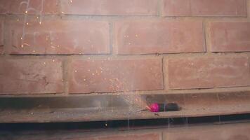 Petard Exploaded Against the Brick Wall. Many Small Particles Flew in Different Directions - Static Shot video