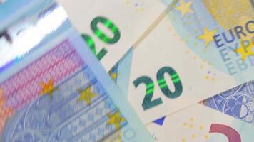 20 Euro Bills, Rotating Money Background - Top View. Euro Money Currency. Blue Paper Money. A Lot of Twenty Euro Banknotes. Business, Finances, Cash and Money Saving Concept - Angular Rotation video