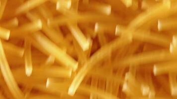 Background of Uncooked Noodles Moving Down - Top View, Close-Up. Raw Pasta in Move. Texture of Dry Vermicelli video