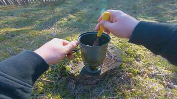 Camp Food. Cooking in a Hike Using a Small Cook Set - First Person View, Wide Angle. Food on the Trip. Traveler in a Spring Forest. Tourist in a Travel is Heating Food - POV Shot. video