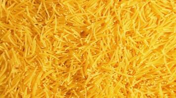 Background of Uncooked Noodles that Slowly Rotating Clockwise - Top View, Close-Up. Texture of Dry Vermicelli Turning Around. Raw Pasta - Right Rotation video