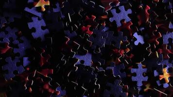 Background of Colored Puzzle Pieces that Slowly Rotating Counterclockwise - Top View. Texture of Incomplete Red and Blue Jigsaw Puzzle with Low Key Light - Left Rotation video