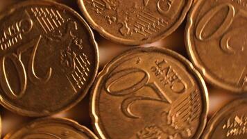 20 Euro Cent Coins, Rotating Money Background - Top View, Macro. Euro Money Currency. A Lot of Twenty Cent Cash. Golden Eurocents. Business, Finances and Money Saving Concept - Rotation Left video