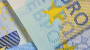 20 Euro Bills, Rotating Money Background - Top View. Euro Money Currency. Blue Paper Money. A Lot of Twenty Euro Banknotes. Business, Finances, Cash and Money Saving Concept - Angular Rotation video