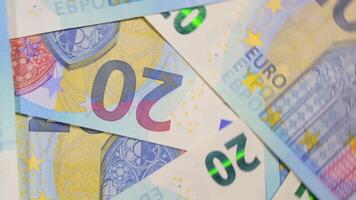 20 Euro Bills, Rotating Money Background - Top View. Euro Money Currency. Blue Paper Money. A Lot of Twenty Euro Banknotes. Business, Finances, Cash and Money Saving Concept - Angular Rotation video