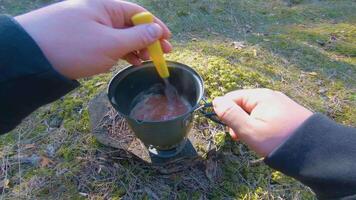 Camp Food. Cooking in a Hike Using a Small Cook Set - First Person View, Wide Angle. Food on the Trip. Traveler in a Spring Forest. Tourist in a Travel is Heating Food - POV Shot. video