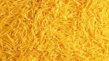 Background of Uncooked Noodles that Slowly Rotating Counterclockwise - Top View, Close-Up. Texture of Dry Vermicelli Turning Around. Raw Pasta - Left Rotation video