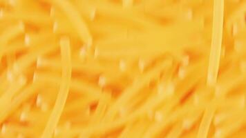 Background of Uncooked Noodles Moving Down - Top View, Close-Up. Raw Pasta in Move. Texture of Dry Vermicelli video
