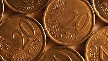 20 Euro Cent Coins, Rotating Money Background - Top View, Macro. Euro Money Currency. A Lot of Twenty Cent Cash. Golden Eurocents. Business, Finances and Money Saving Concept - Slow Rotation Left video