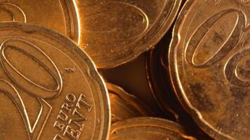 Scattered 20 Euro Cent Coins, Rotating Money Background - Top View, Macro. Euro Money Currency. A Lot of Twenty Cent Cash. Business, Finances and Money Saving Concept - Slow Rotation Left video