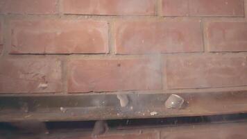 Firecracker Exploaded in Wineglass Against a Brick Wall - Super Slow Motion. The Blast Wave of a Petard Damaged the Glass and Many Small Fragments of Glass Flew in Different Directions - Static Shot video