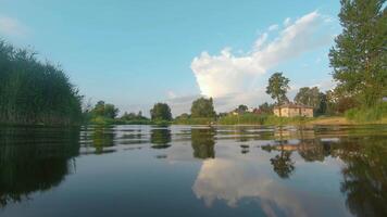 Over and Under River Surface with Water Reflections - Low Angle View. Underwater Split View with Waves at Sunny Summer Day - Slow Motion video