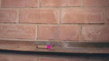 Petard Exploaded Against the Brick Wall. Many Small Particles Flew in Different Directions - Static Shot video