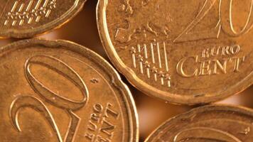 20 Euro Cent Coins, Rotating Money Background - Top View, Macro. Euro Money Currency. A Lot of Twenty Cent Cash. Golden Eurocents. Business, Finances and Money Saving Concept - Slow Rotation Right video