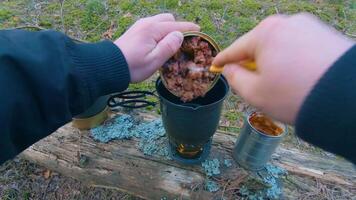 Camp Food. Cooking in a Hike Using a Small Cook Set - First Person View, Wide Angle. Food on the Trip. Traveler in a Spring Forest. Tourist in a Travel is Heating Food - POV Shot. video