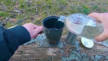 Camp Food. Cooking in a Hike Using a Small Cook Set - First Person View, Wide Angle. Food on the Trip. Traveler in a Spring Forest. Tourist in a Travel is Heating Food - POV Shot. video