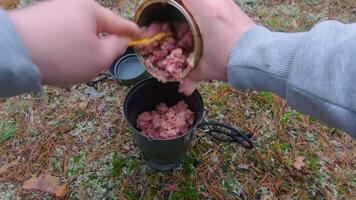 Camp Food. Cooking in a Forest Using a Small Cook Set - First Person View, Wide Angle. Food on the Trip. Traveler in a Forest. Tourist in a Travel is Heating Food - POV Shot video