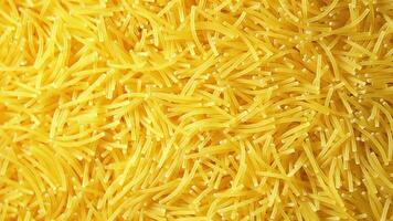 Background of Uncooked Noodles that Slowly Rotating Clockwise - Top View, Angular Rotation. Texture of Dry Vermicelli Turning Around. Raw Pasta - Right Rotation video