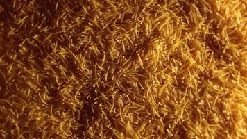 Background of Uncooked Golden Noodles that Rotating Clockwise - Top View. Texture of Dry Vermicelli Turning Around. Raw Pasta with Low Key Light - Right Rotation video