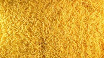Background of Uncooked Noodles that Slowly Rotating Counterclockwise - Top View. Texture of Dry Vermicelli Turning Around. Raw Pasta - Left Rotation video