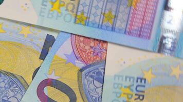20 Euro Bills, Rotating Money Background - Top View. Euro Money Currency. Blue Paper Money. A Lot of Twenty Euro Banknotes. Business, Finances, Cash and Money Saving Concept - Angular Rotation video