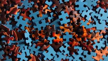 Background of Colored Puzzle Pieces that Rotating Counterclockwise - Top View. Texture of Incomplete Red and Blue Jigsaw Puzzle with Low Key Light - Left Rotation video