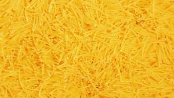 Background of Uncooked Noodles that Slowly Rotating Counterclockwise - Top View, Close-Up. Texture of Dry Vermicelli Turning Around. Raw Pasta - Left Rotation video