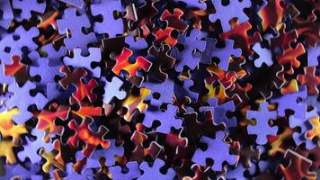 Background of Colored Puzzle Pieces that Rotating Clockwise - Top View. Texture of Incomplete Red and Blue Jigsaw Puzzle - Right Rotation video