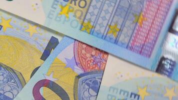 20 Euro Bills, Rotating Money Background - Top View. Euro Money Currency. Blue Paper Money. A Lot of Twenty Euro Banknotes. Business, Finances, Cash and Money Saving Concept - Angular Rotation video