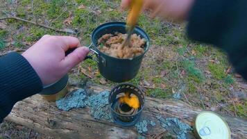 Camp Food. Cooking in a Hike Using a Small Cook Set - First Person View, Wide Angle. Food on the Trip. Traveler in a Spring Forest. Tourist in a Travel is Heating Food - POV Shot. video
