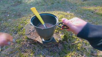 Camp Food. Cooking in a Hike Using a Small Cook Set - First Person View, Wide Angle. Food on the Trip. Traveler in a Spring Forest. Tourist in a Travel is Heating Food - POV Shot. video