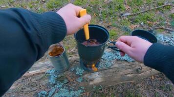 Camp Food. Cooking in a Hike Using a Small Cook Set - First Person View, Wide Angle. Food on the Trip. Traveler in a Spring Forest. Tourist in a Travel is Heating Food - POV Shot. video