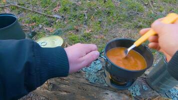 Camp Food. Cooking in a Hike Using a Small Cook Set - First Person View, Wide Angle. Food on the Trip. Traveler in a Spring Forest. Tourist in a Travel is Heating Food - POV Shot. video