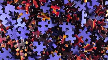 Background of Colored Puzzle Pieces that Slowly Rotating Counterclockwise - Top View. Texture of Incomplete Red and Blue Jigsaw Puzzle - Left Rotation video