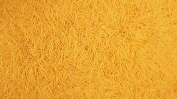 Background of Uncooked Golden Noodles that Rotating Clockwise - Top View. Texture of Dry Vermicelli Turning Around. Raw Pasta - Right Rotation video