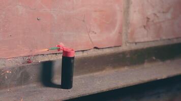Firecracker Was Lighted Up With a Gasoline Lighter then Explode Against a Brick Wall. Many Small Particles Flew in a Different Directions - Static Shot video
