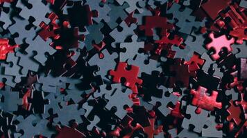 Background of Colored Puzzle Pieces that Slowly Rotating Clockwise - Top View. Texture of Incomplete Red and Grey Jigsaw Puzzle with Low Key Light - Right Rotation video