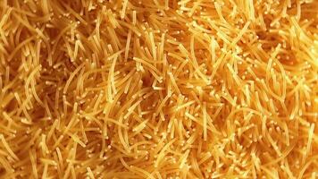 Background of Uncooked Noodles that Rotating Counterclockwise - Top View, Close-Up. Texture of Dry Vermicelli Turning Around. Raw Pasta with Low Key Light - Left Rotation video