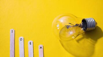 Stop motion Ice cream Stick with word Idea with lightbulb on yellow background video