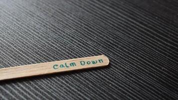 Ice cream Stick with word Calm down on table with eyeglasses video