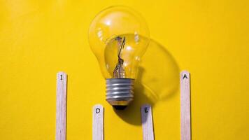 Stop motion Ice cream Stick with word Idea with lightbulb with yellow background video