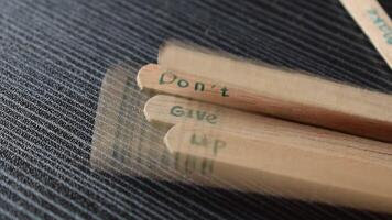 Ice cream stick with word Dont Give Up on wood table video