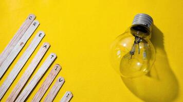 Stop motion Ice cream Stick with word Creativity with lightbulb on yellow background video