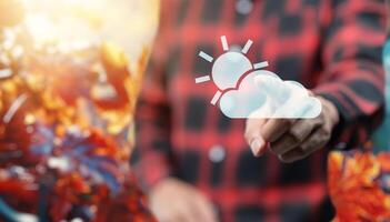 A person is holding a cloud with a sun and a cloud photo