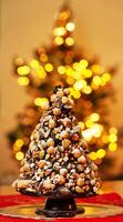 A christmas tree made out of nuts and chocolate photo