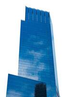 A tall building with a blue sky and clouds photo