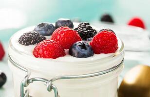 Yogurt with berries and raspberries photo
