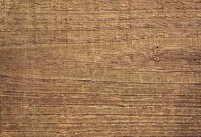 A close up of a wooden surface with a few scratches photo